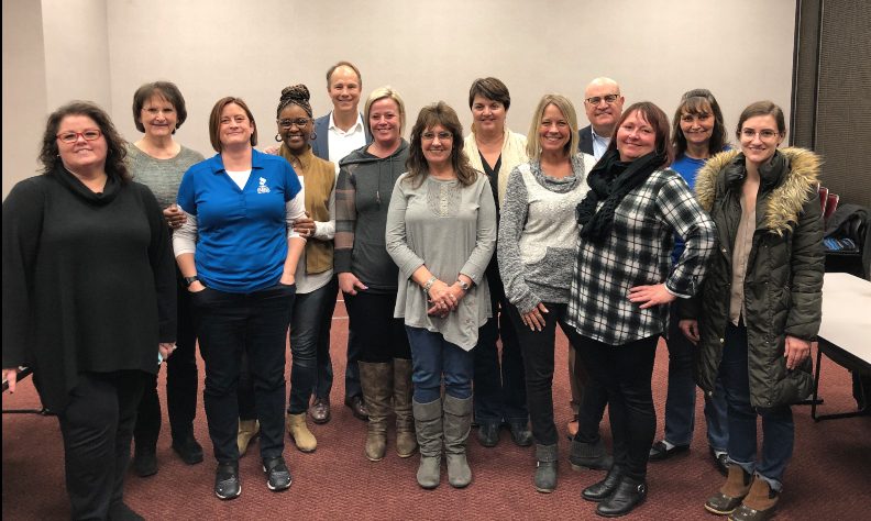 Healthcare leaders with Tim Shurr following a leadership session