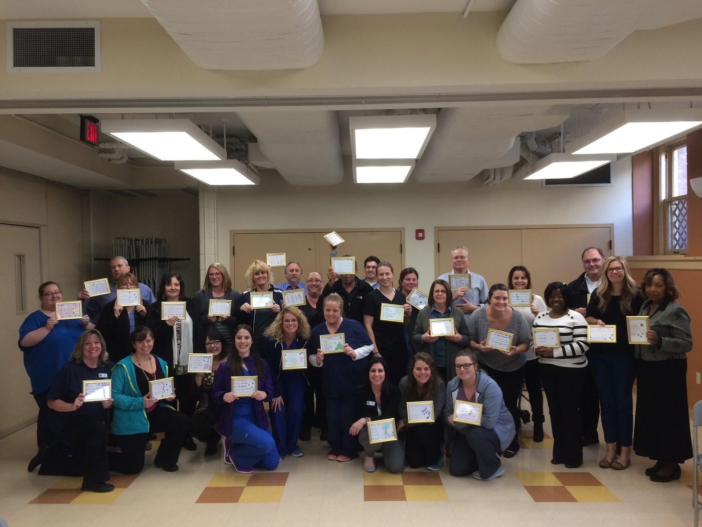 Hospital staff holding certificates after Tim Shurr training